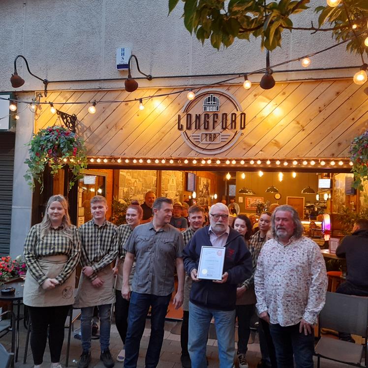 The Tap Owners receiving their award